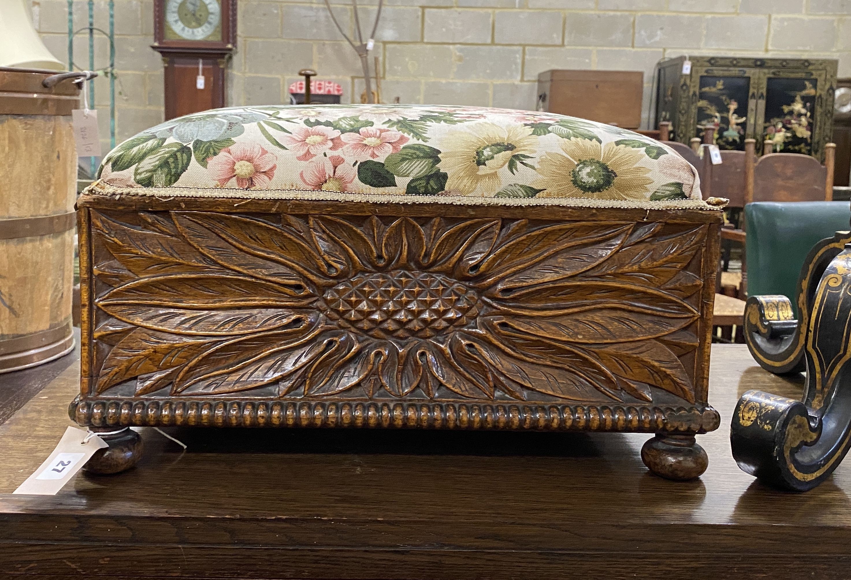 An early 20th century rectangular carved oak footstool, length 46cm, depth 42cm, height 26cm